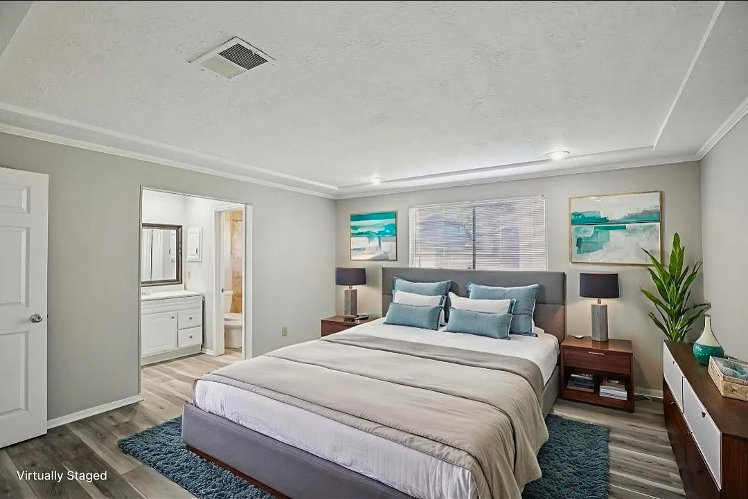 3715 Wells Mark Drive Humble, TX 77396 - Photo 13 of 16 a bedroom with a large bed and a potted plant