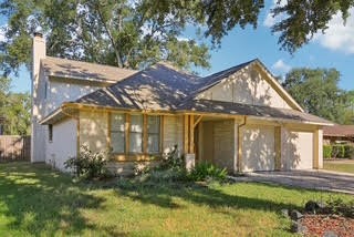 3715 Wells Mark Drive Humble, TX 77396 - Photo 2 of 16 a view of a house with a yard and plants