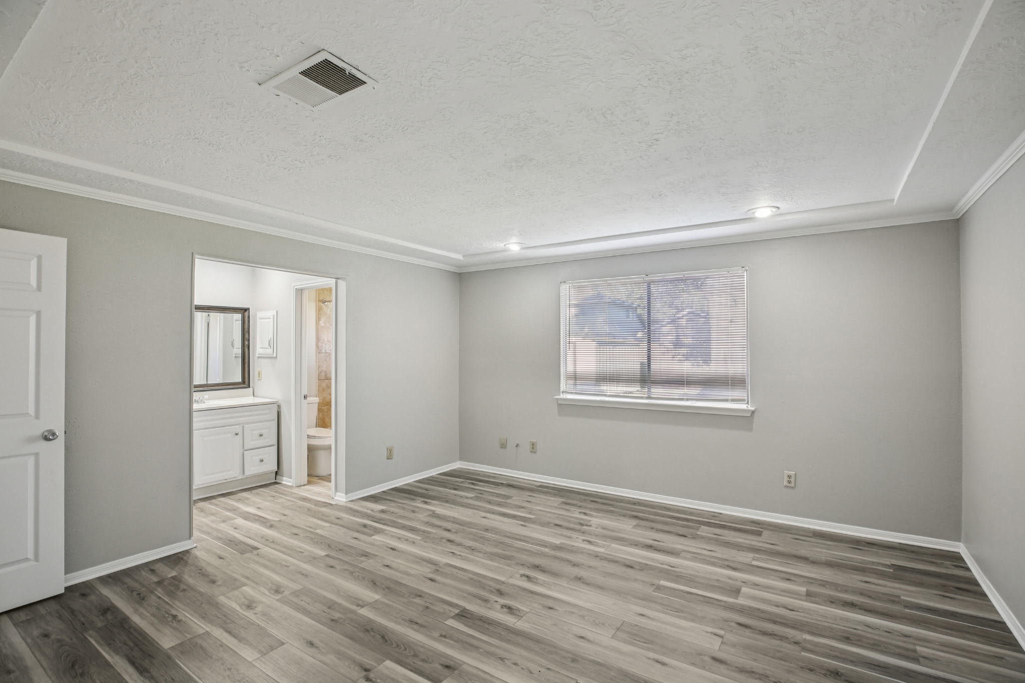 3715 Wells Mark Drive Humble, TX 77396 - Photo 3 of 16 a view of empty room with wooden floor and fan