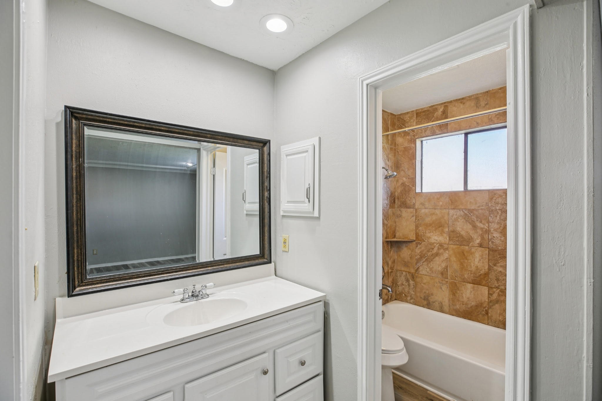 3715 Wells Mark Drive Humble, TX 77396 - Photo 7 of 16 a bathroom with a bathtub and a shower
