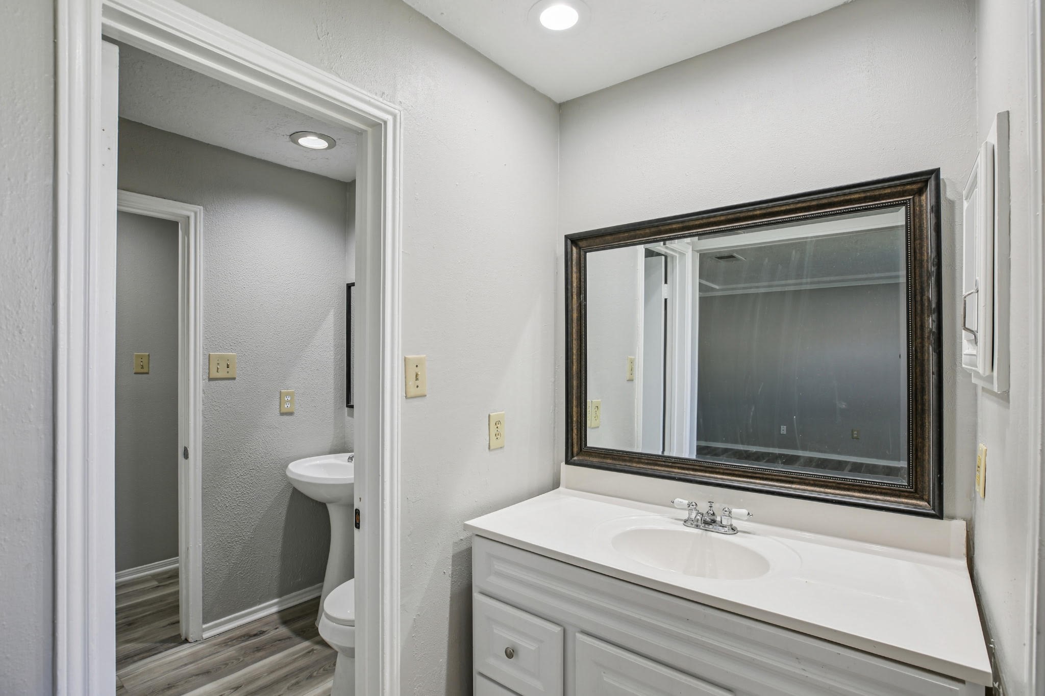 3715 Wells Mark Drive Humble, TX 77396 - Photo 8 of 16 a bathroom with a sink a toilet and a mirror