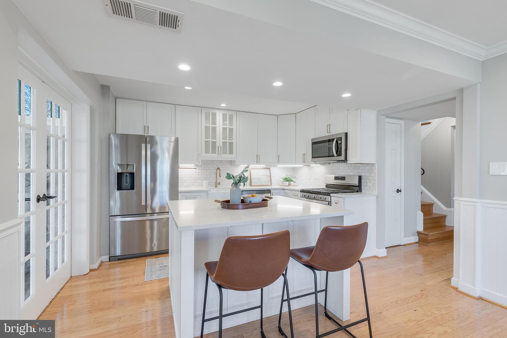 7003 Vancouver Road Springfield, VA 22152 - Photo 11 of 38 a kitchen with stainless steel appliances granite countertop a refrigerator and a stove top oven