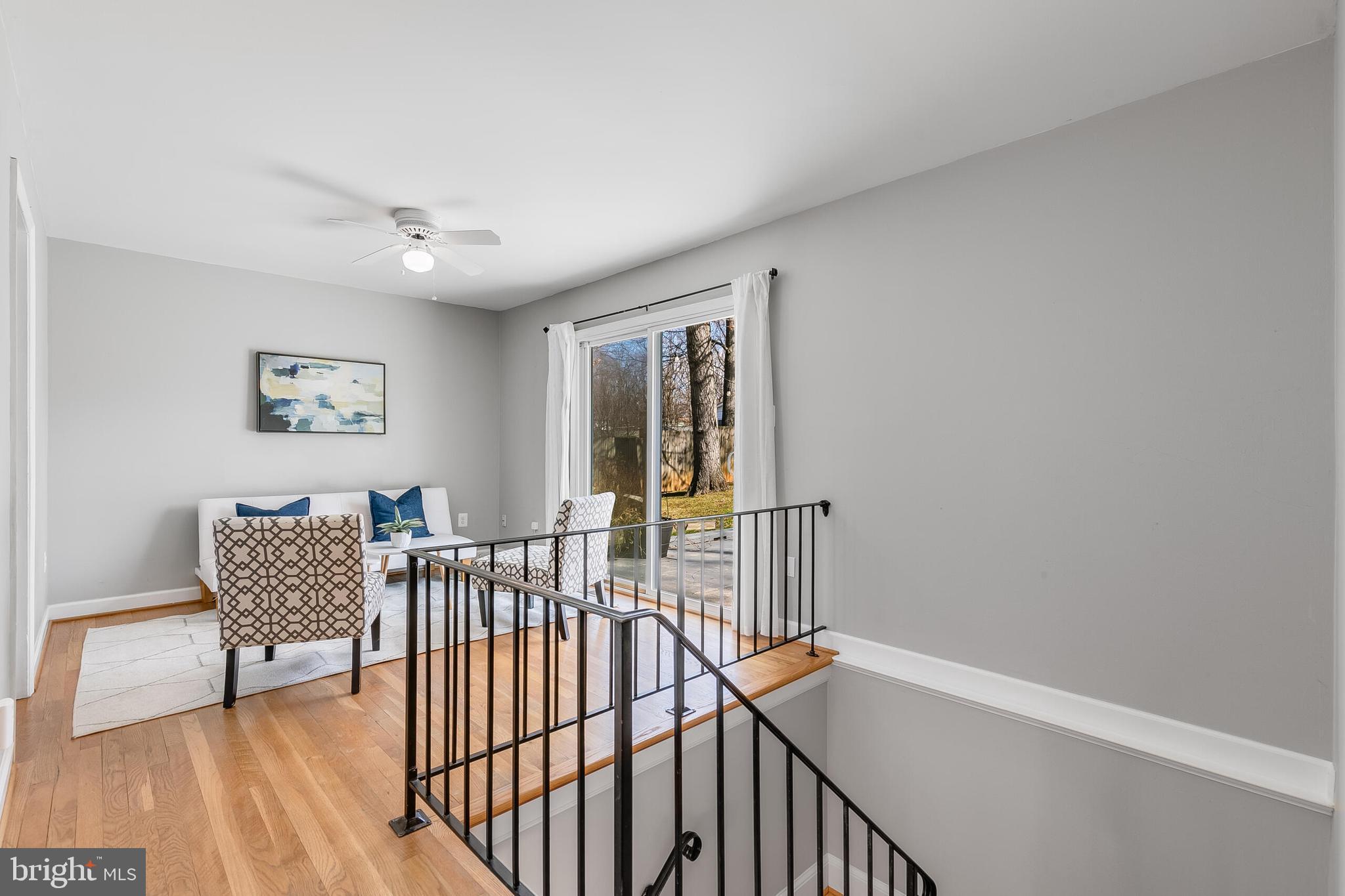 7003 Vancouver Road Springfield, VA 22152 - Photo 23 of 38 a view of a hallway with wooden floor and a potted plant