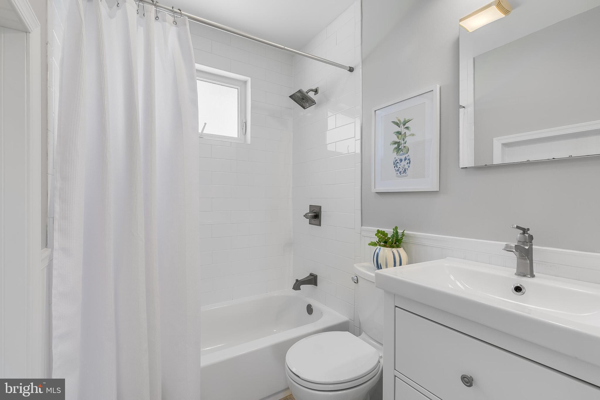 7003 Vancouver Road Springfield, VA 22152 - Photo 31 of 38 a bathroom with a sink a toilet and shower