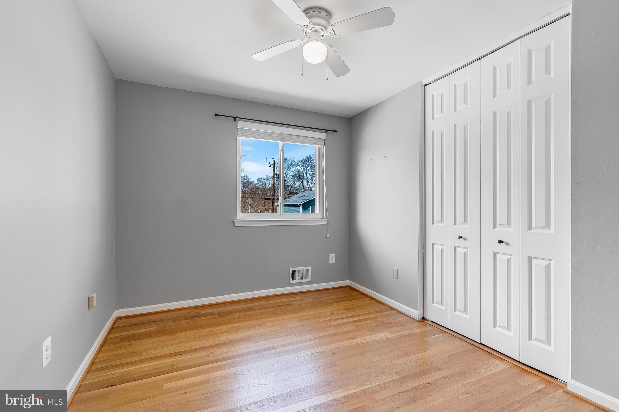 7003 Vancouver Road Springfield, VA 22152 - Photo 32 of 38 wooden floor in an empty room with a window