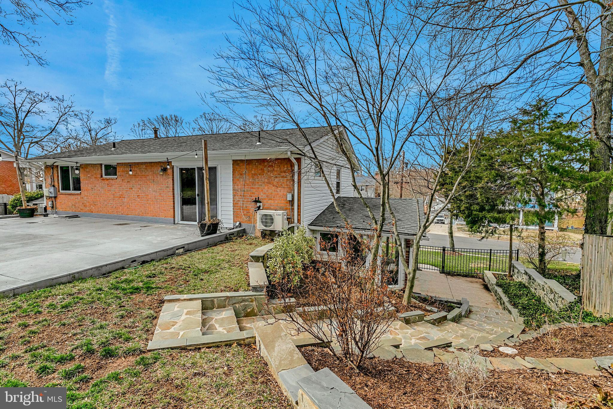 7003 Vancouver Road Springfield, VA 22152 - Photo 35 of 38 a view of a yard with plants and a tree
