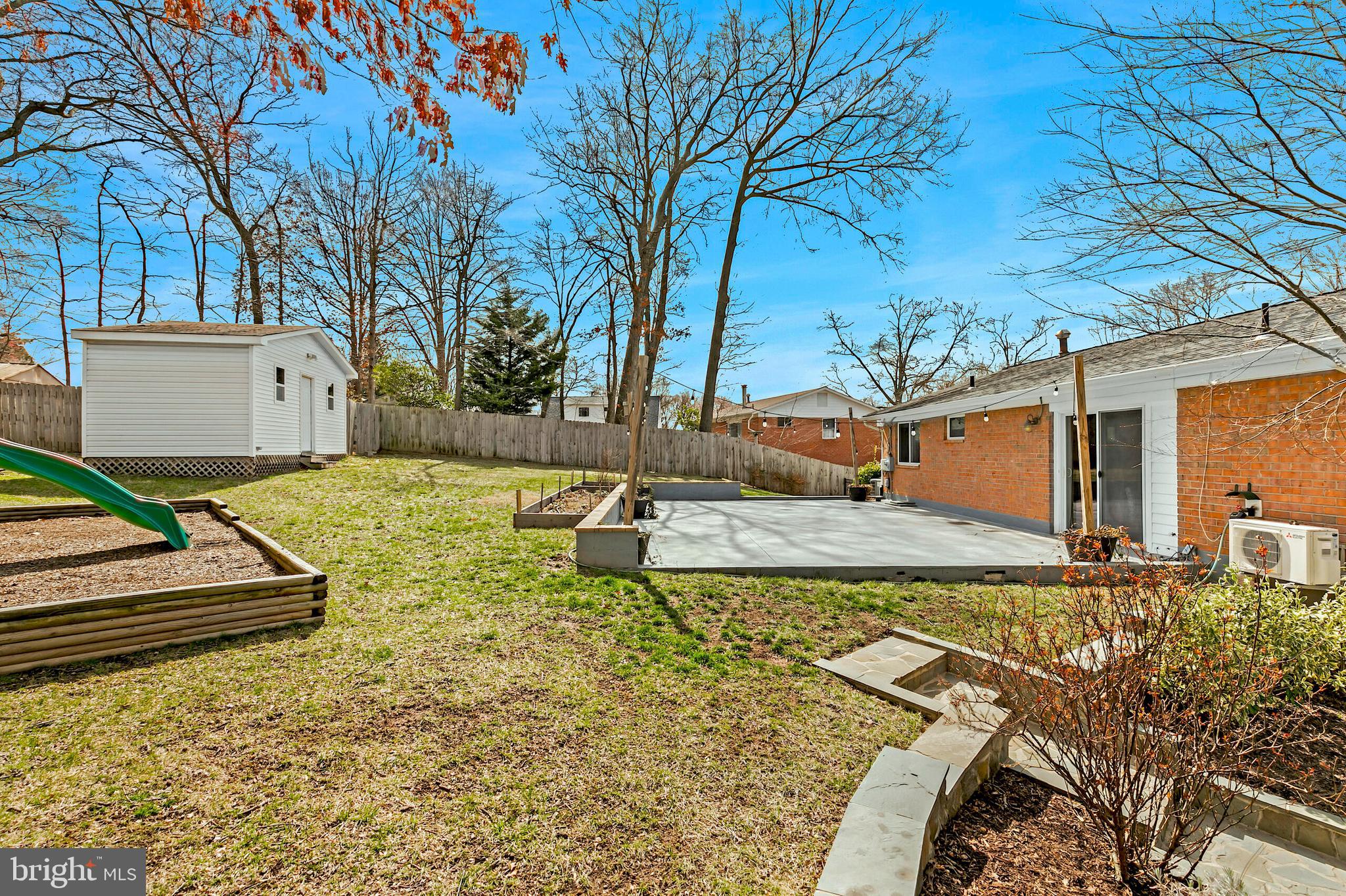 7003 Vancouver Road Springfield, VA 22152 - Photo 36 of 38 a view of a house with pool and sitting area