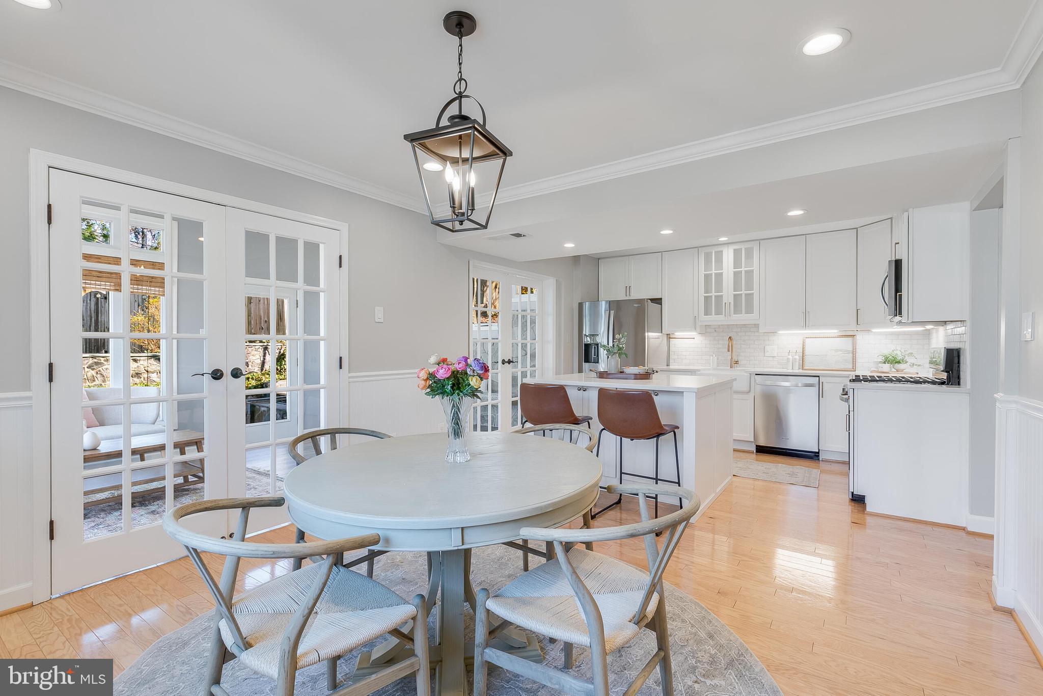 7003 Vancouver Road Springfield, VA 22152 - Photo 6 of 38 a view of a dining room with furniture and a chandelier