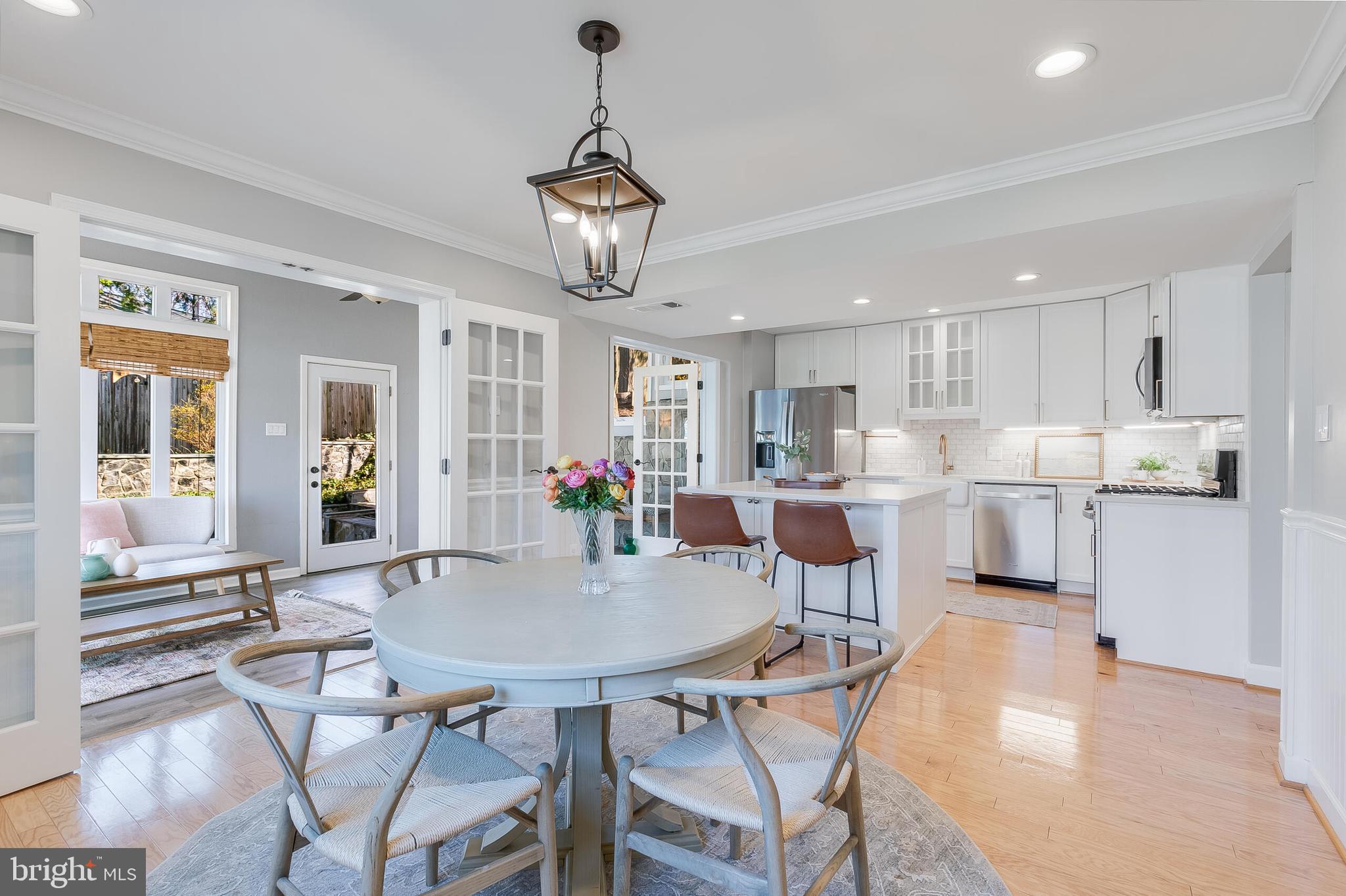 7003 Vancouver Road Springfield, VA 22152 - Photo 7 of 38 a view of a dining room with furniture and a chandelier