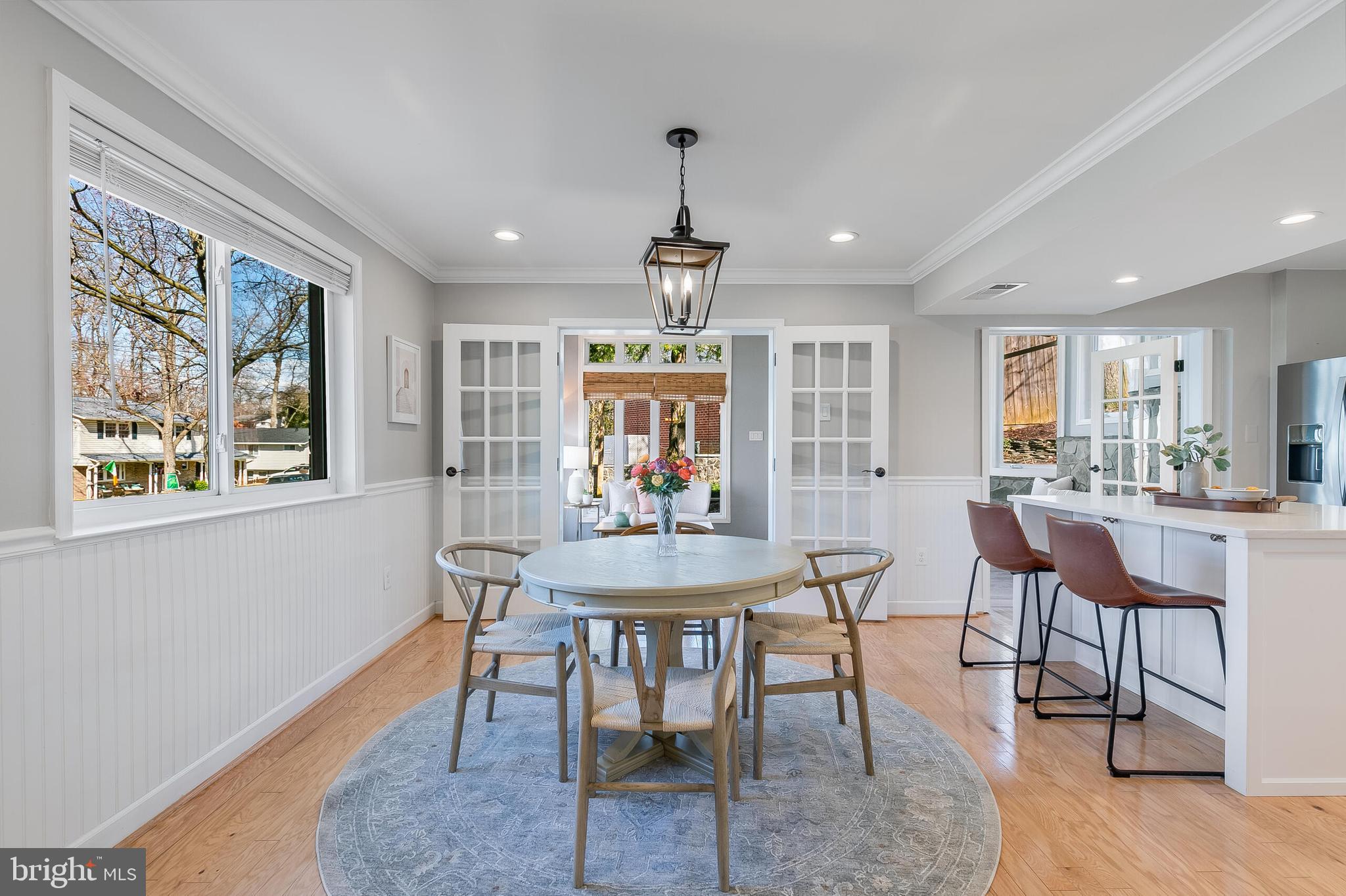 7003 Vancouver Road Springfield, VA 22152 - Photo 8 of 38 a view of a a dining room with furniture window and wooden floor