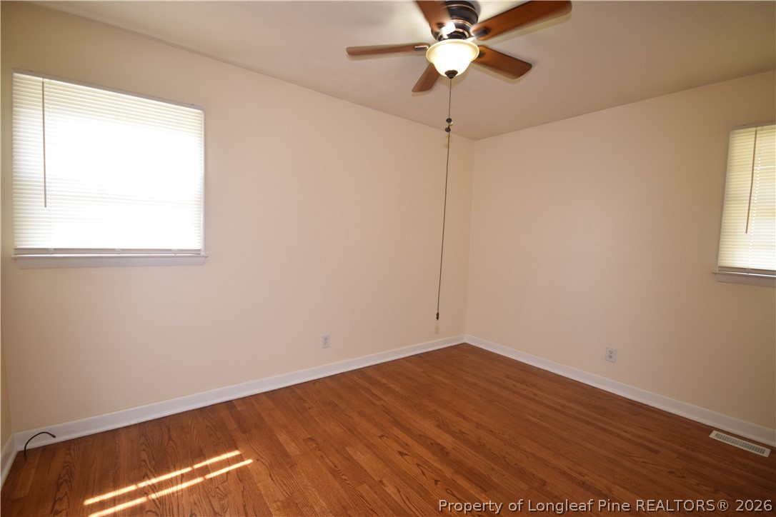 108 South 6th Street Spring Lake, NC 28390 - Photo 6 of 20 an empty room with a window and a fan