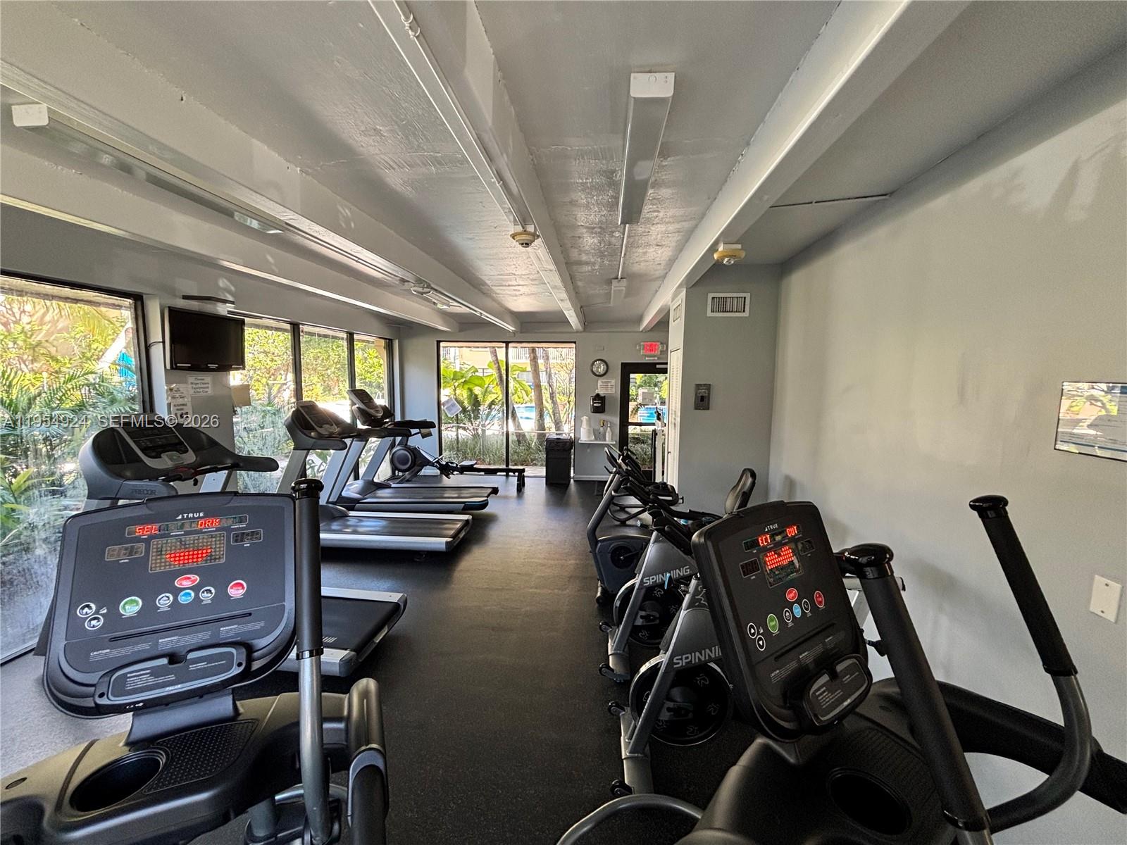 9301 Southwest 92nd Avenue, Unit A320 Miami, FL 33176 - Photo 16 of 20 a view of a room with gym equipment