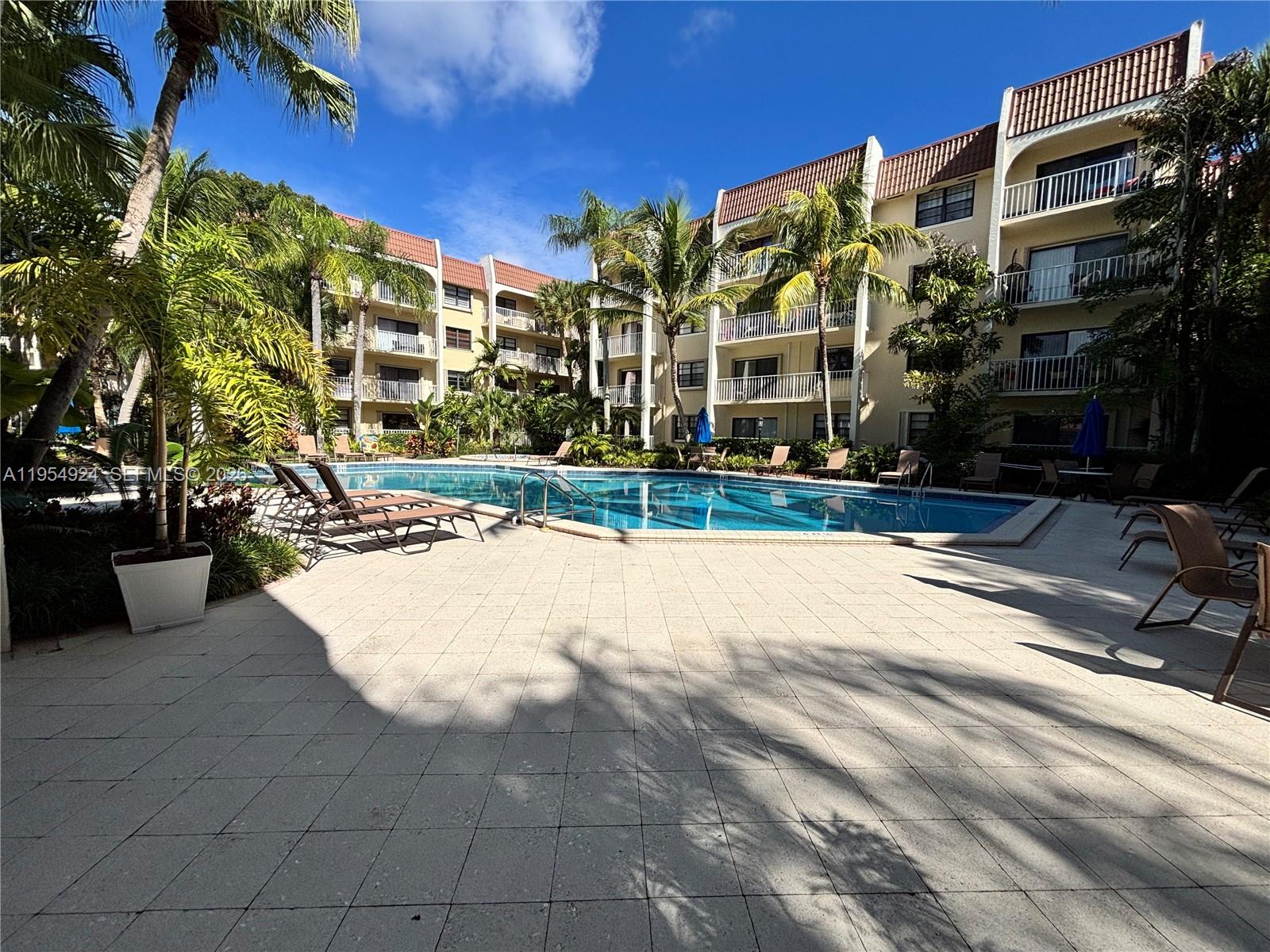 9301 Southwest 92nd Avenue, Unit A320 Miami, FL 33176 - Photo 19 of 20 a view of a building with a yard