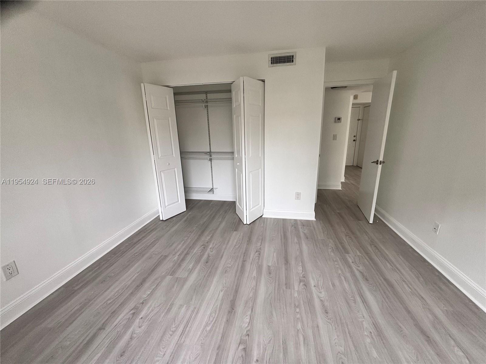 9301 Southwest 92nd Avenue, Unit A320 Miami, FL 33176 - Photo 8 of 20 a view of a room with wooden floor