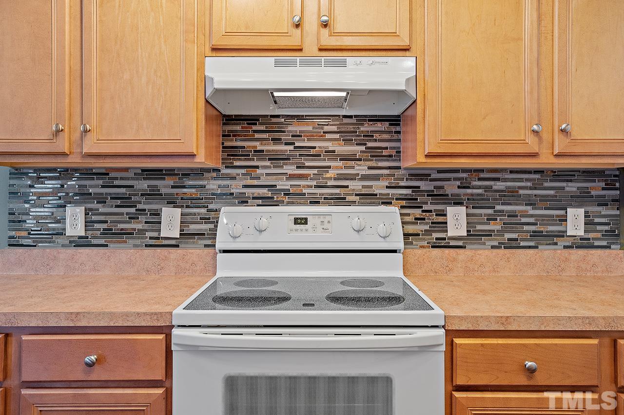 1909 Rathie Drive Durham, NC 27703 - Photo 12 of 32 a stove top oven sitting inside of a kitchen