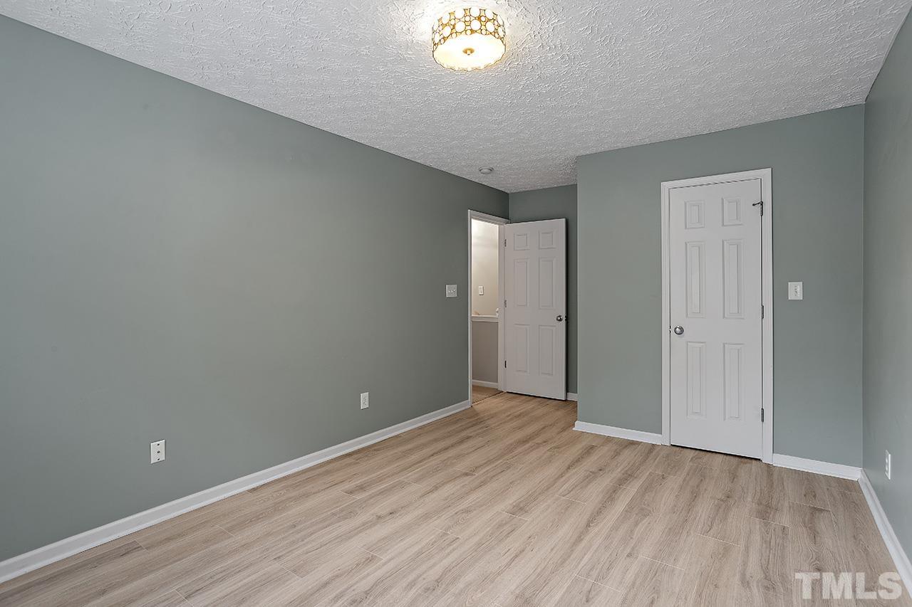1909 Rathie Drive Durham, NC 27703 - Photo 17 of 32 a view of an empty room and window