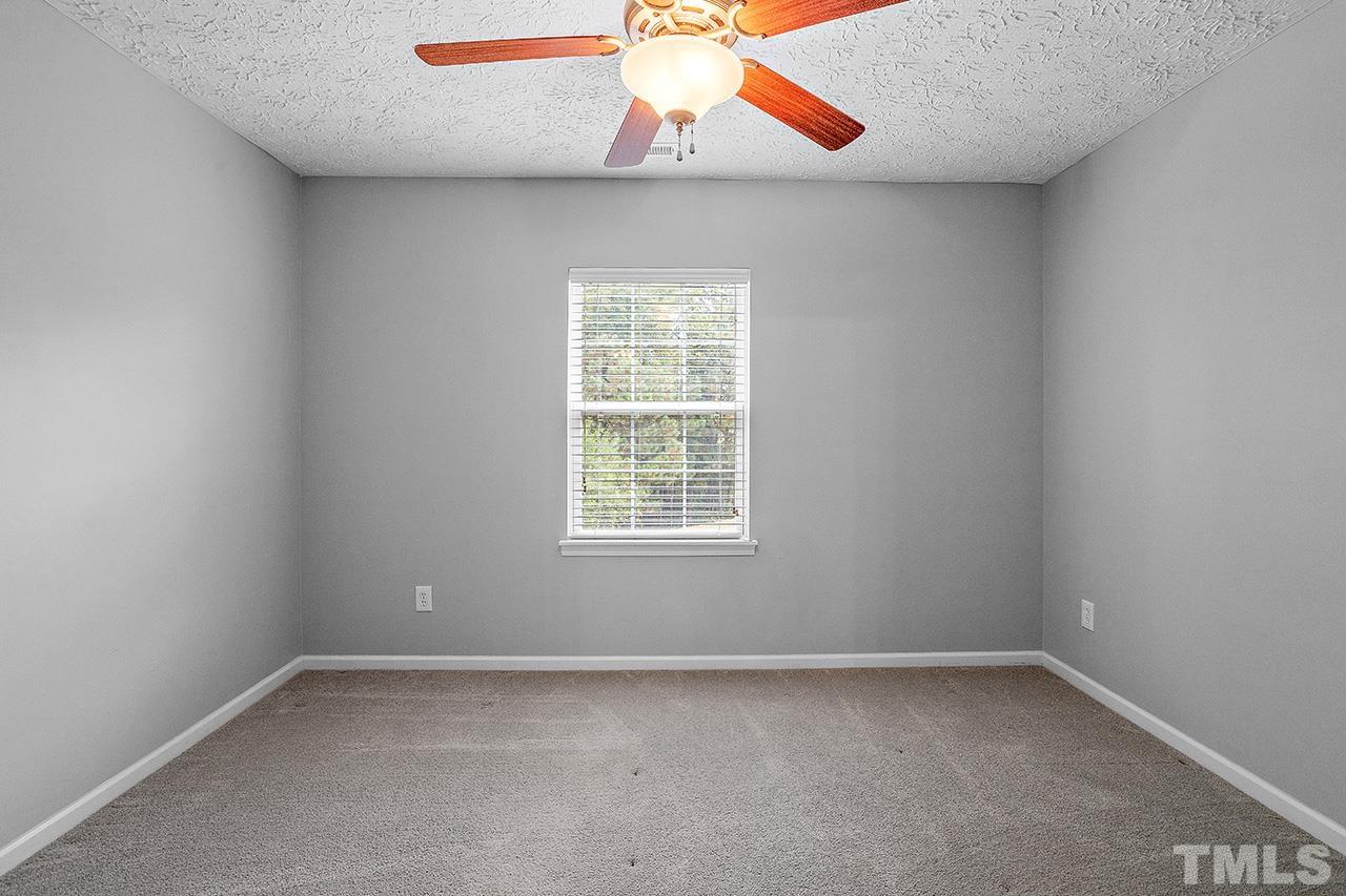 1909 Rathie Drive Durham, NC 27703 - Photo 18 of 32 an empty room with a window