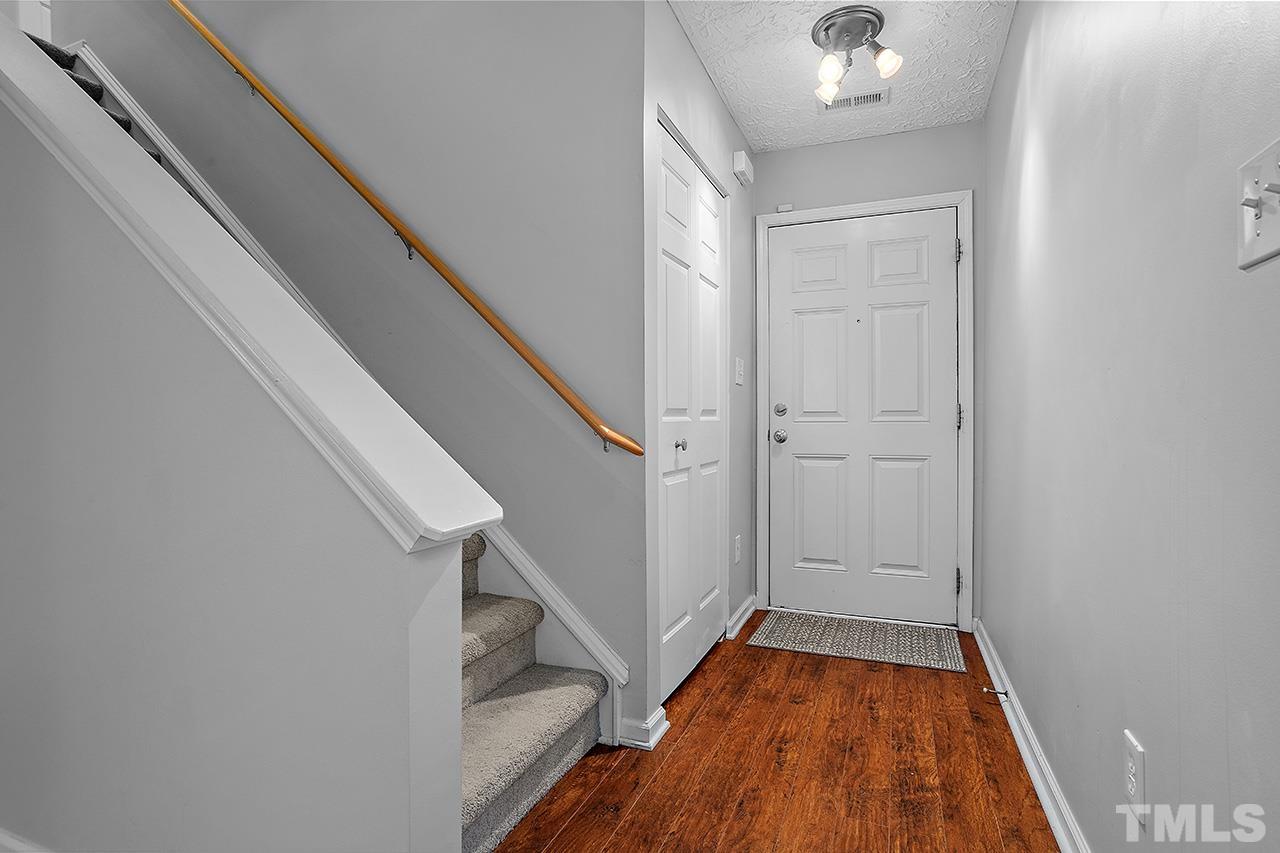 1909 Rathie Drive Durham, NC 27703 - Photo 2 of 32 a view of entryway with wooden floor