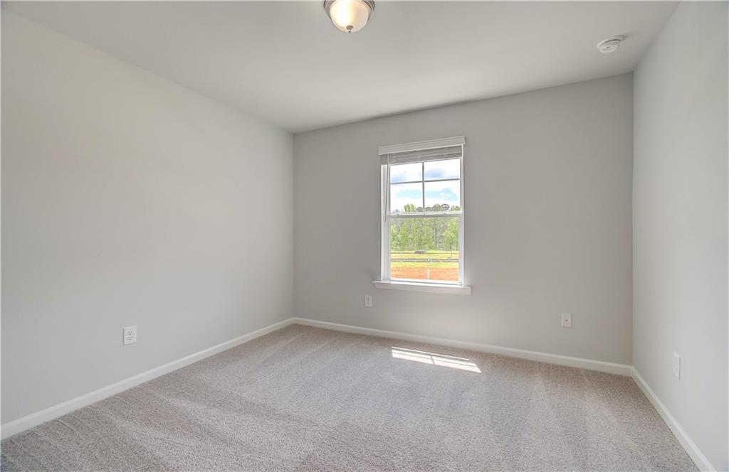 117 Alpine Road Fairburn, GA 30213 - Photo 17 of 29 an empty room with windows