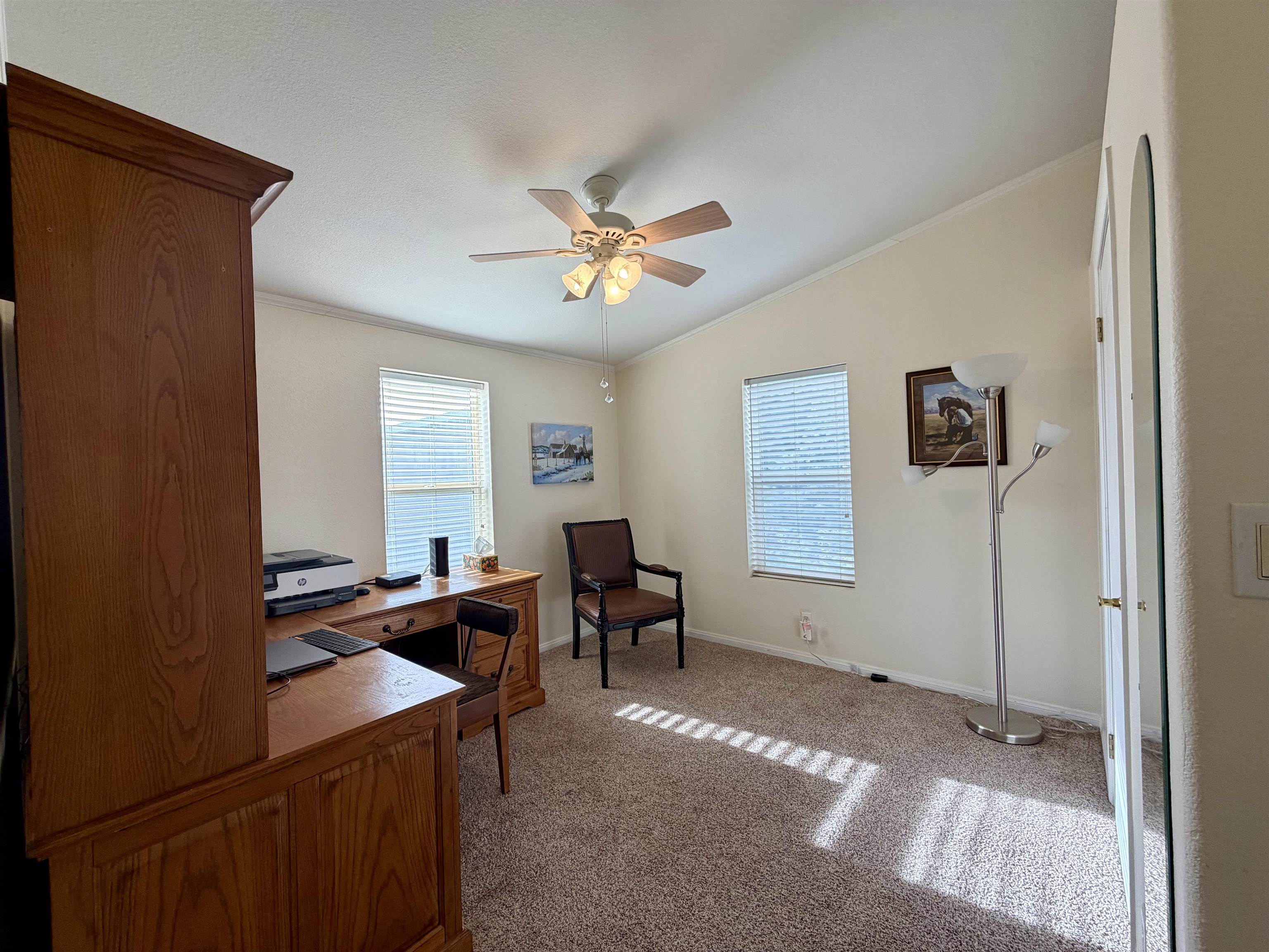 435 32 Road, Unit 480 Clifton, CO 81520 - Photo 17 of 23 a living room with furniture and a chandelier