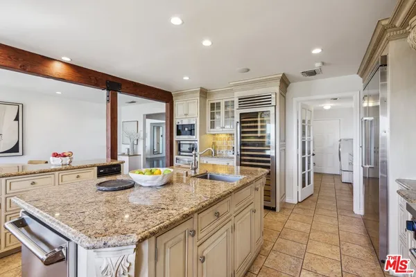 a kitchen with a table and chairs