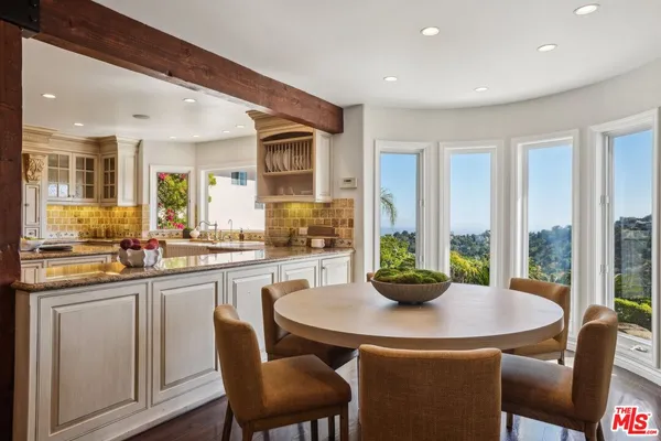 a living room with furniture and a book shelf