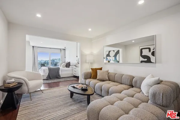 a kitchen with stainless steel appliances kitchen island granite countertop a sink and a counter