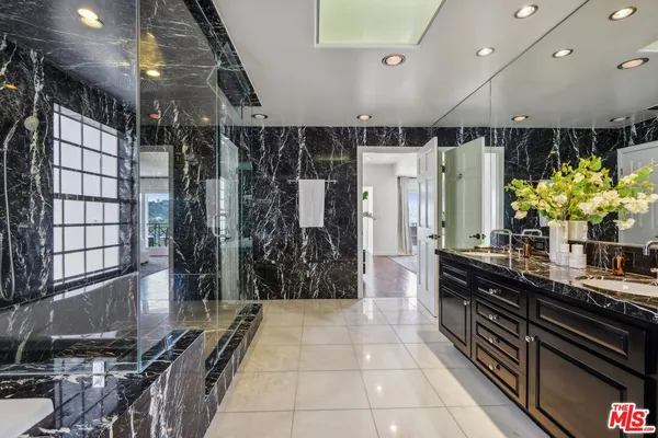 a view of a chairs and table in the balcony