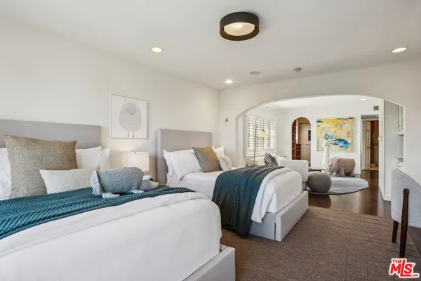 an aerial view of residential houses with city view