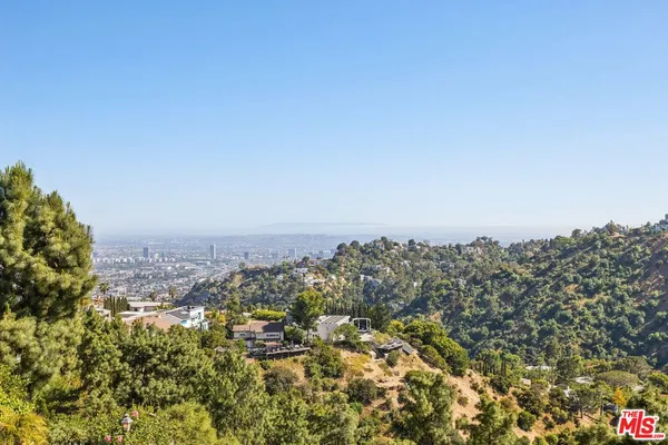 an aerial view of a swimming pool and outdoor space