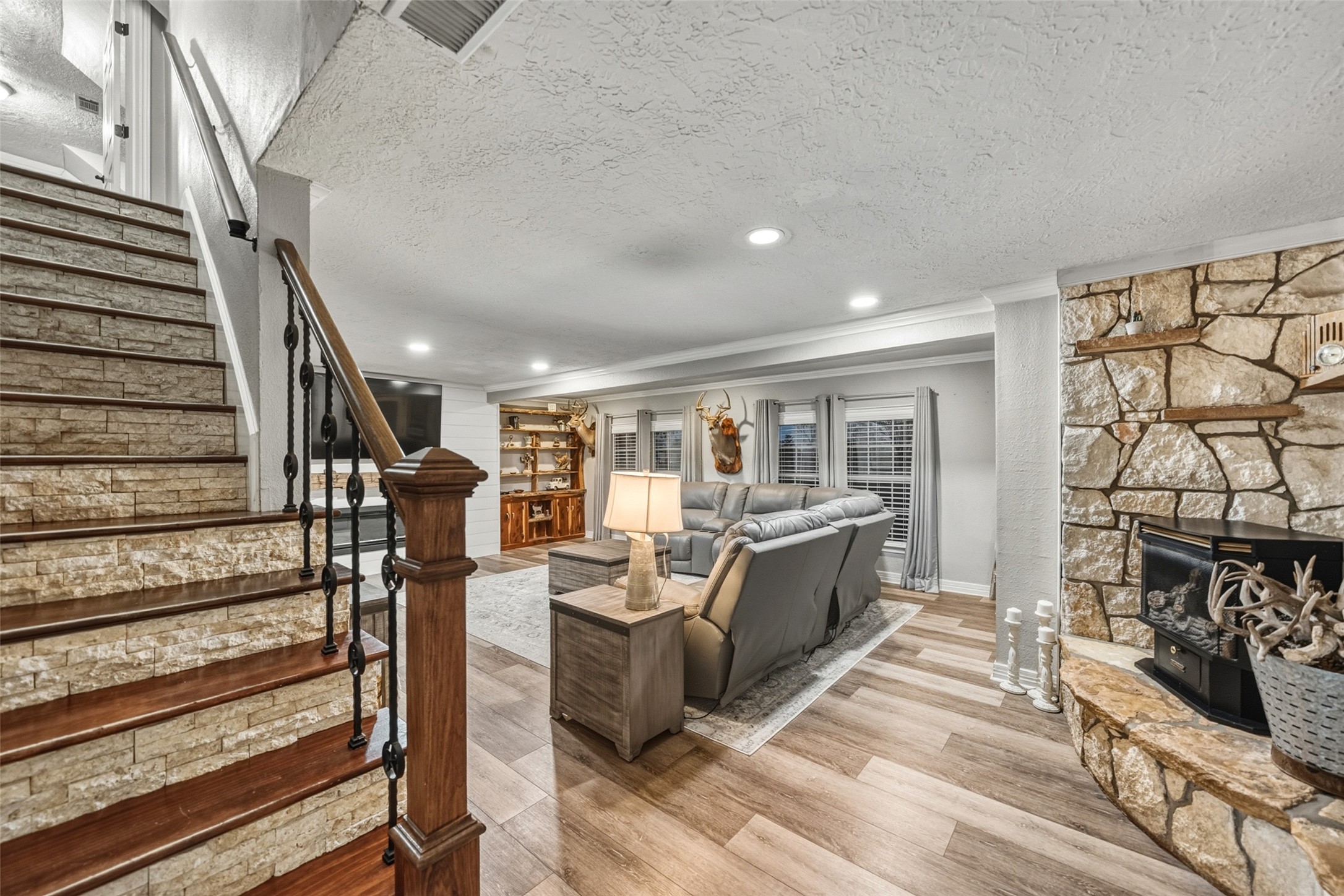 19989 Meadow Bend Road Hempstead, TX 77445 - Photo 15 of 35 Spacious living area offers flexible furniture placement, durable flooring, and consistent lighting across the main level.