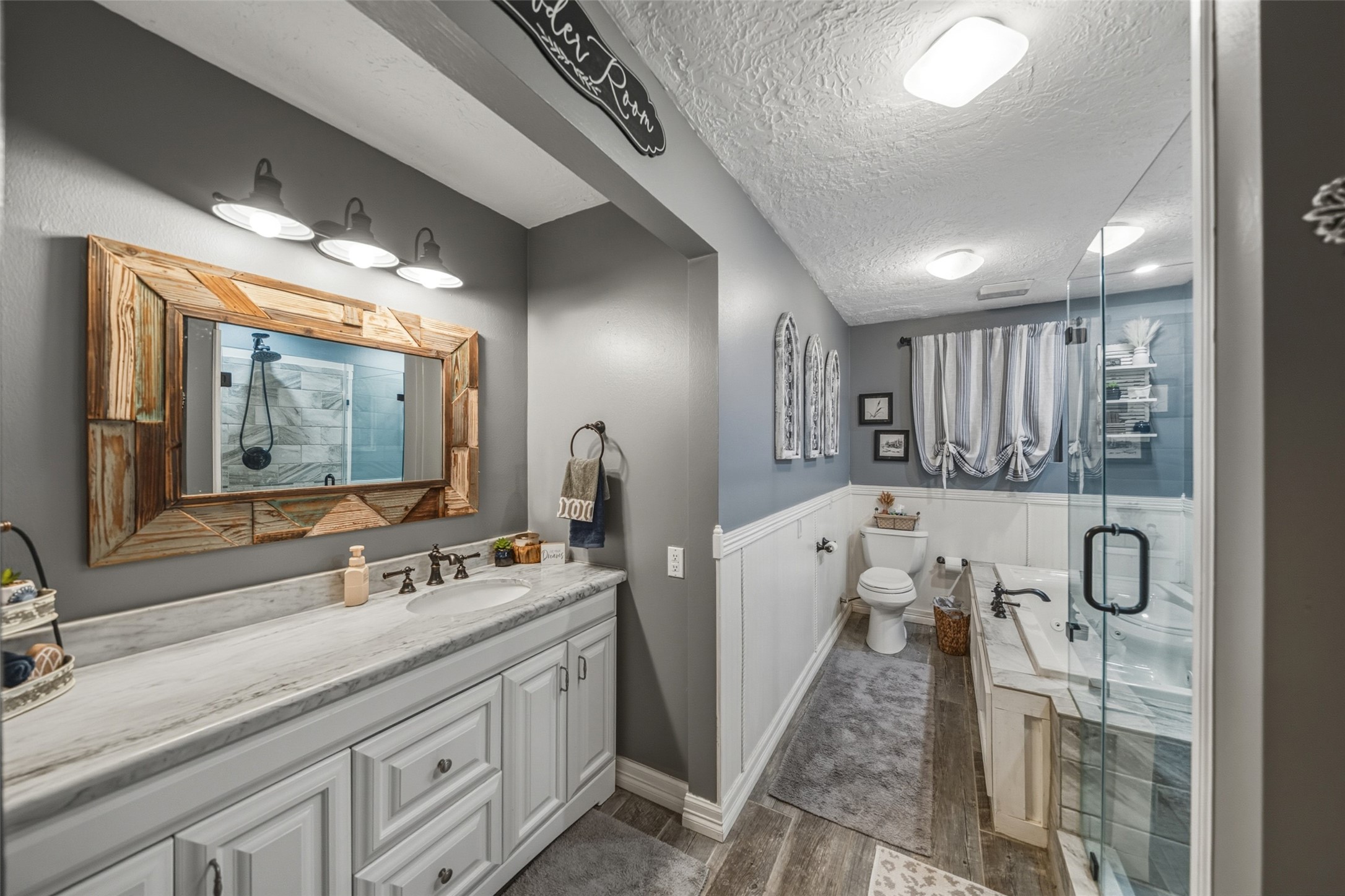 19989 Meadow Bend Road Hempstead, TX 77445 - Photo 23 of 35 Downstairs bathroom includes updated finishes with a clean, functional layout and modern lighting.