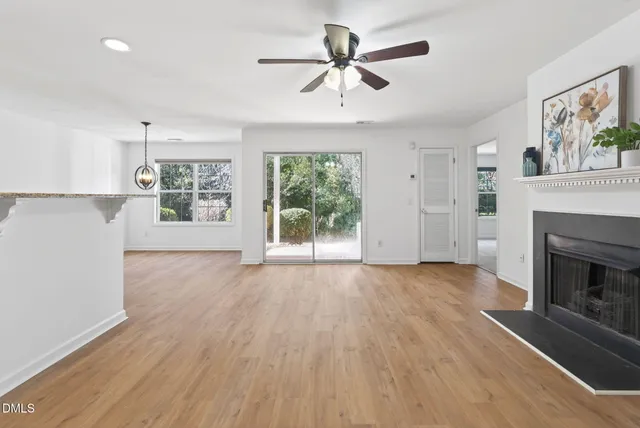 a view of a kitchen with a sink and a refrigerator