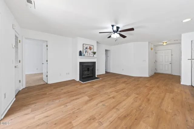 a view of a room with wooden floor and view