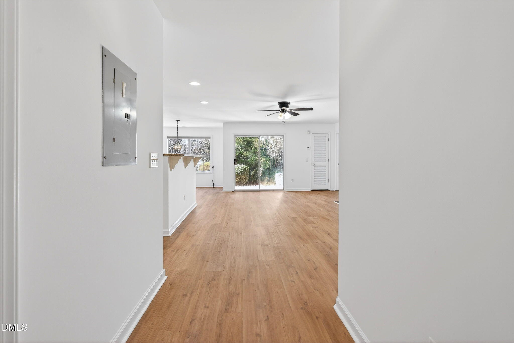 3612 Wellington Ridge Loop Cary, NC 27518 - Photo 2 of 35 a view of a hallway with wooden floor and staircase