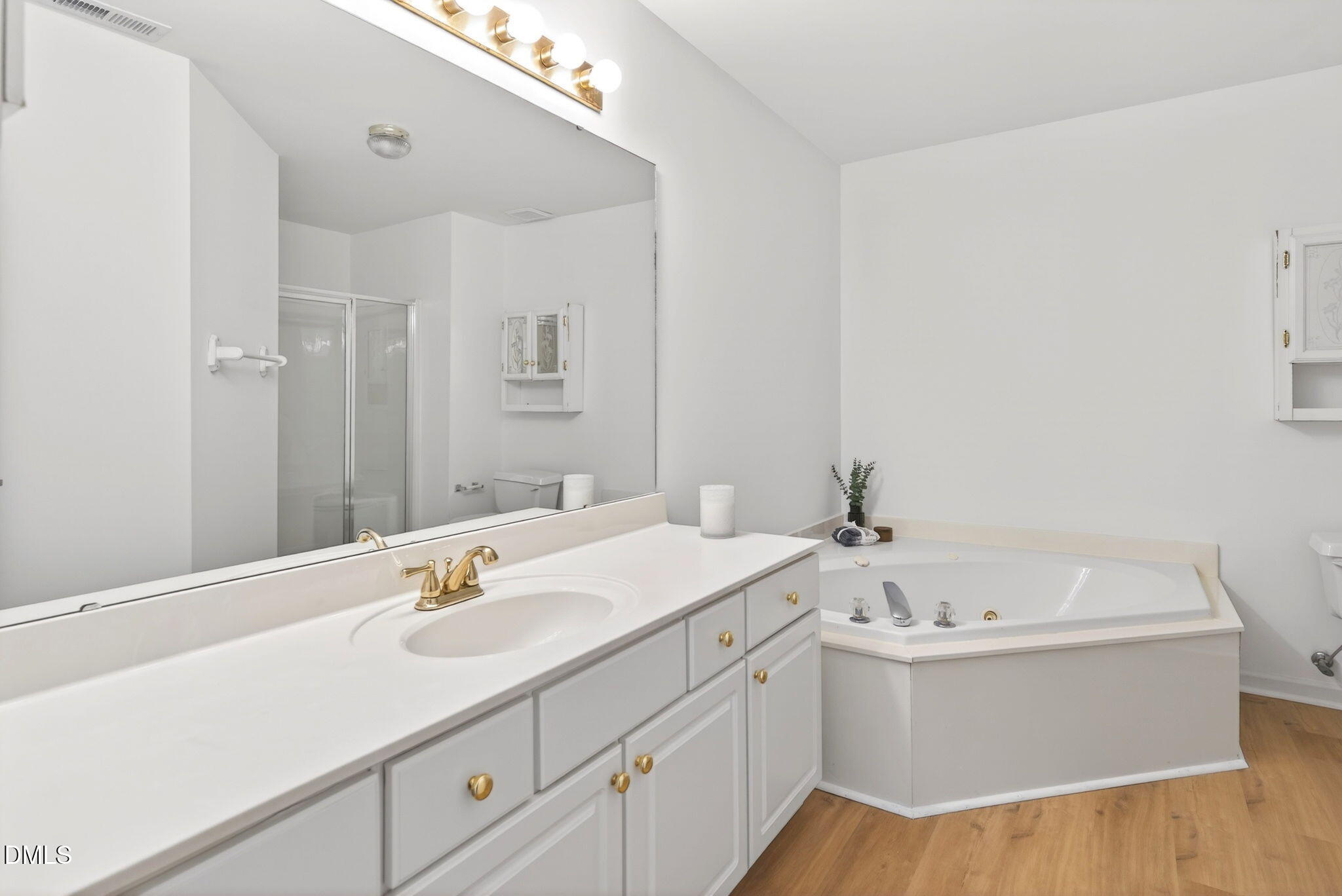 3612 Wellington Ridge Loop Cary, NC 27518 - Photo 21 of 35 a bathroom with a bathtub and a sink