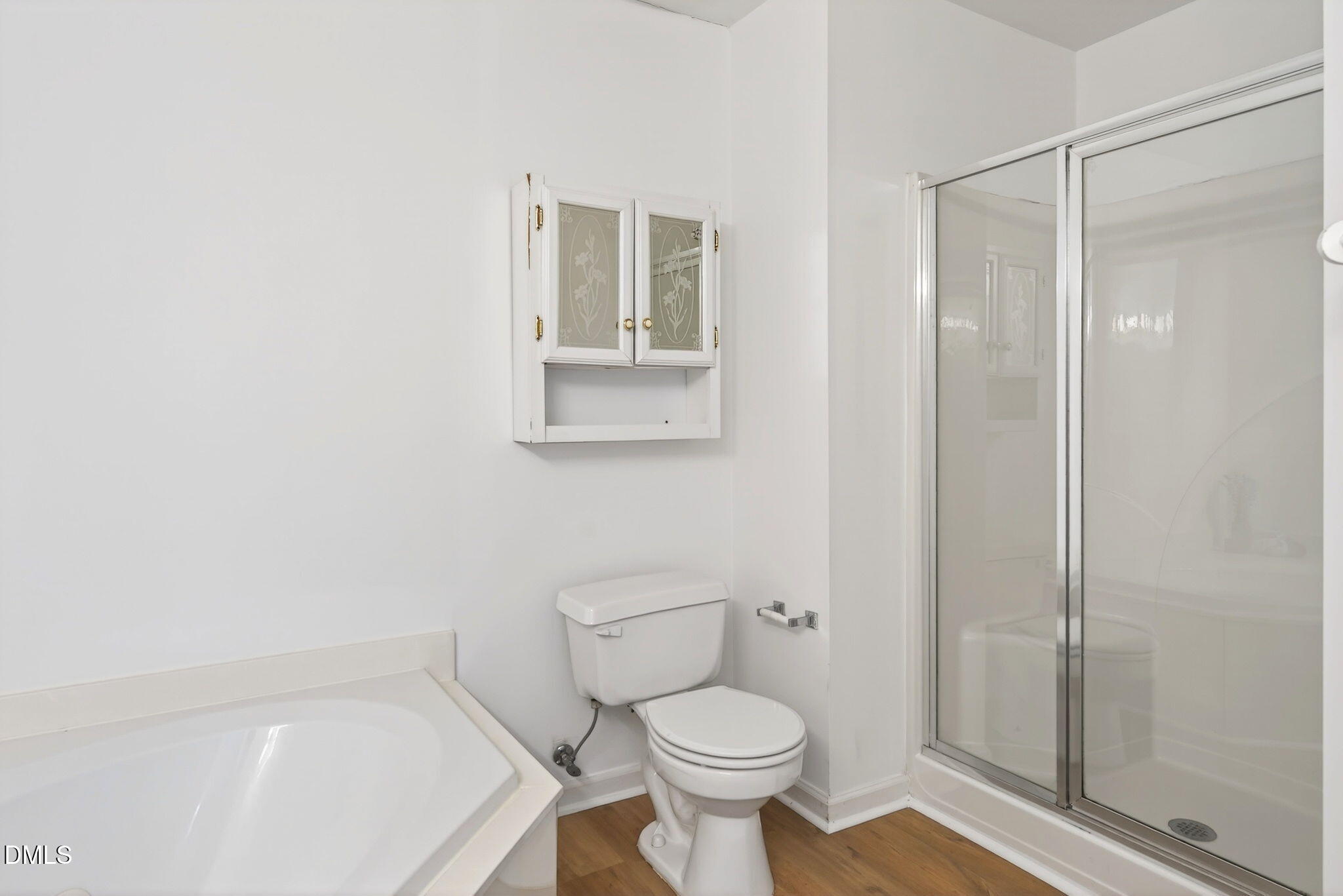 3612 Wellington Ridge Loop Cary, NC 27518 - Photo 22 of 35 a bathroom with a toilet and a shower