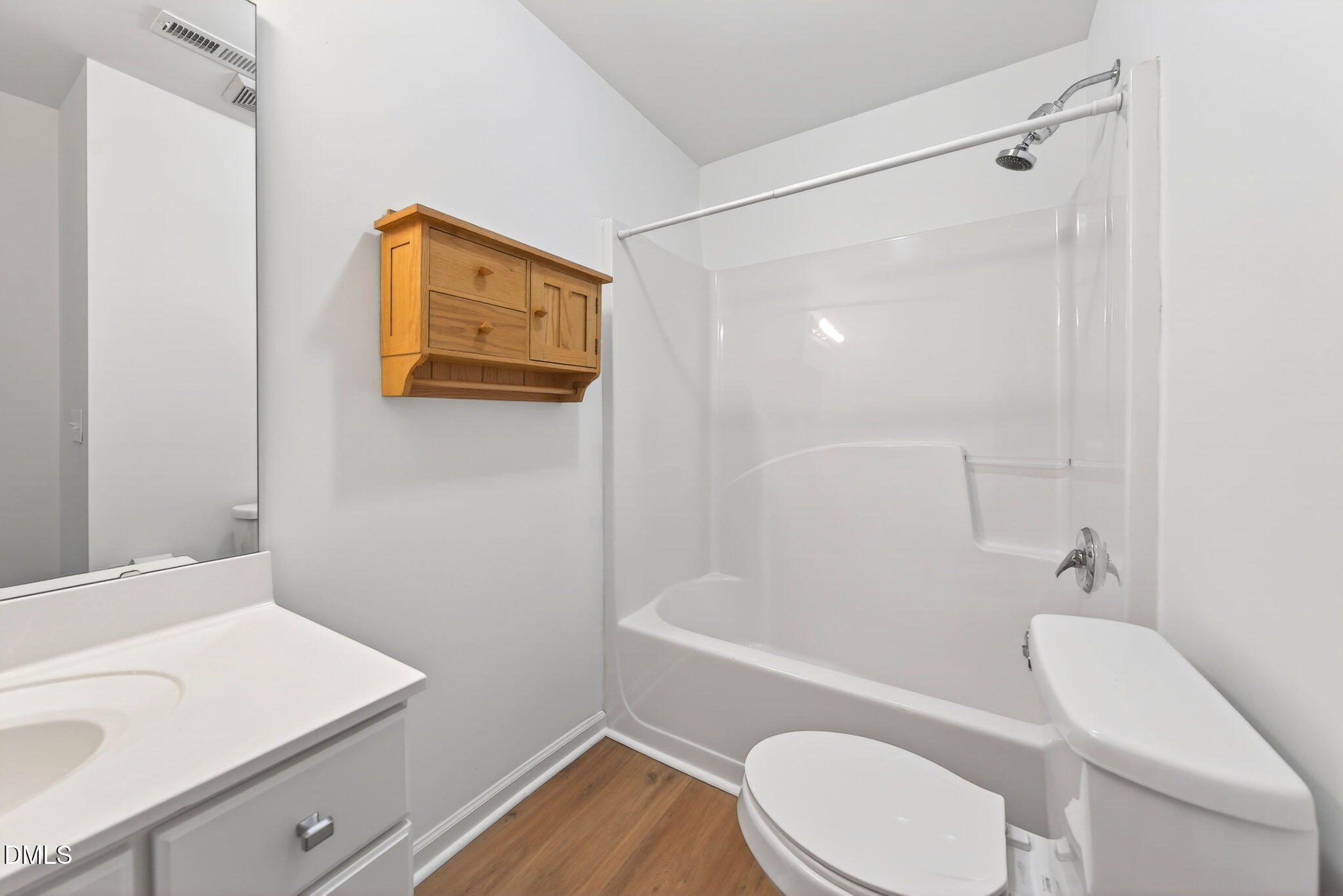 3612 Wellington Ridge Loop Cary, NC 27518 - Photo 26 of 35 a bathroom with a sink a toilet and shower
