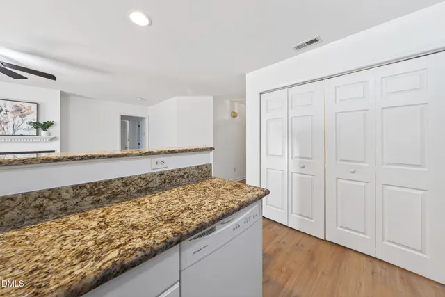 a kitchen with a stove and a refrigerator