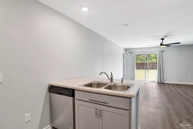 a kitchen with a sink and cabinets