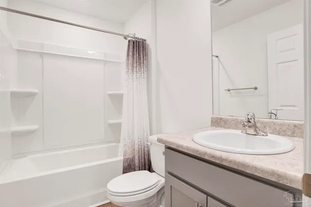 a bathroom with a shower and a toilet