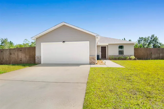 a house view with swimming pool in front of it