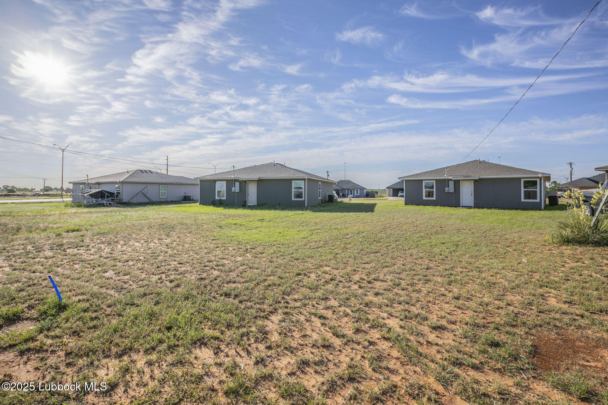 3511 East Colgate Street Lubbock, TX 79403 - Photo 16 of 18 a view of a lake with house in the background