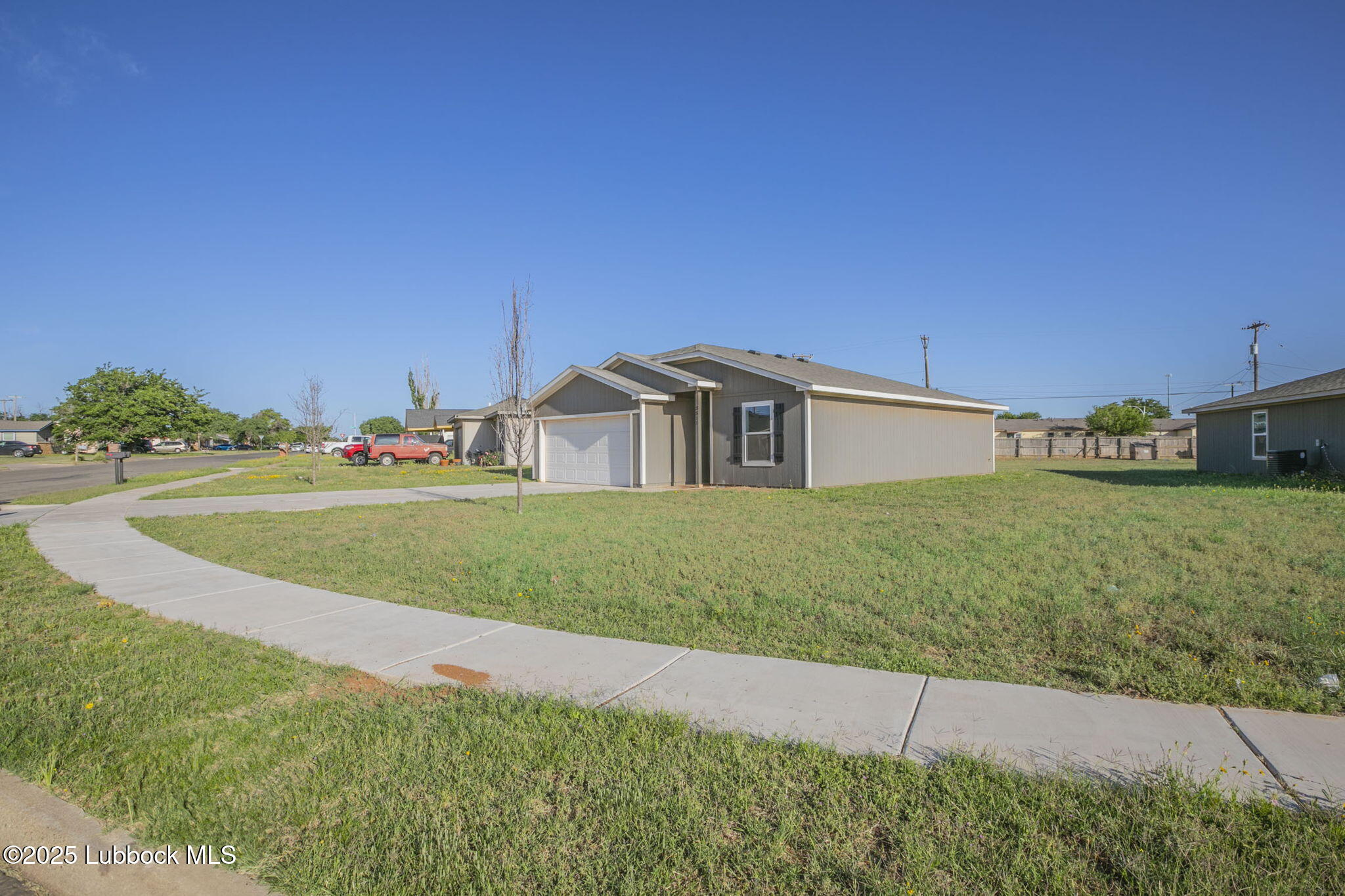 3511 East Colgate Street Lubbock, TX 79403 - Photo 18 of 18 a front view of a house with a yard