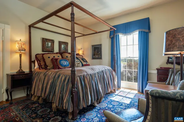 a bedroom with furniture and a window