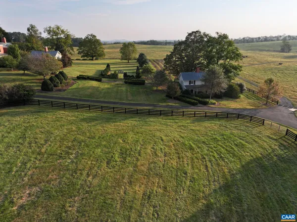 a view of a lake with a yard