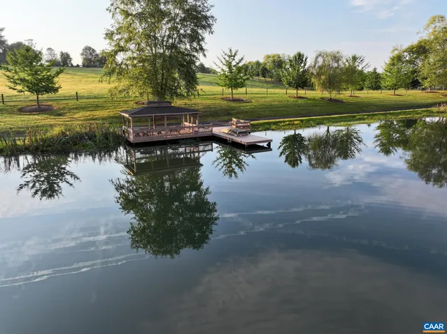 a view of house with yard and entertaining space