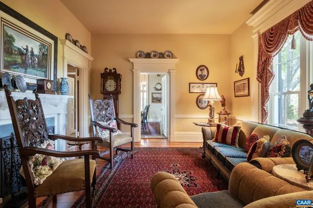 a view of a dining room with furniture wooden floor and a chandelier