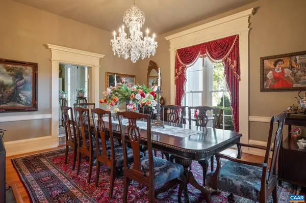 a living room with furniture and large windows