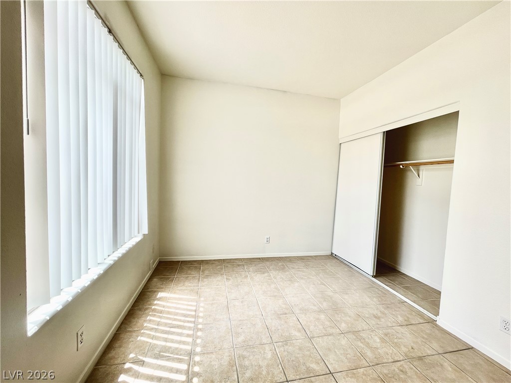 2201 Ramsgate Drive, Unit 915 Henderson, NV 89074 - Photo 23 of 36 A well-proportioned bedroom with ample natural light and generous closet space.